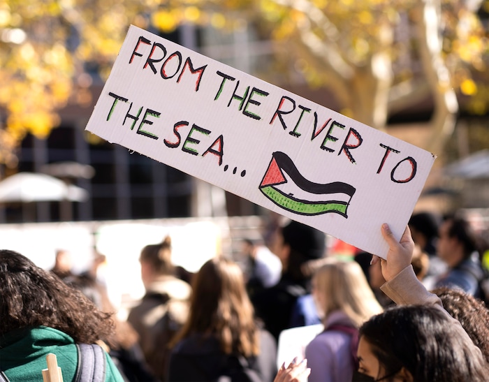 (Rick Egan | The Salt Lake Tribune)  Supporters of Mecha cheer along with the speakers, during a protest on the University of Utah Campus, on Wednesday, Nov. 15, 2023.
