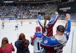 (Chris Samuels | The Salt Lake Tribune) Colorado Avalanche fans Ross and Emily Parker of Ogden wave at Avalanche players during warmups in Salt Lake City, Friday, Dec. 27, 2024.