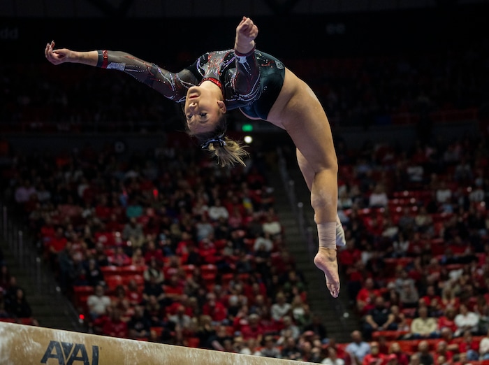 (Rick Egan | The Salt Lake Tribune)  Makenna Smith performs on the beam, in gymnastics action between Utah Red Rocks and Oregon State, at the Jon M. Huntsman Center, on Friday, Feb. 2, 2024.
