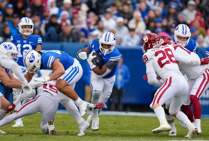 (Bethany Baker  |  The Salt Lake Tribune) Brigham Young Cougars running back Aidan Robbins (3) runs the ball against the Oklahoma Sooners at LaVell Edwards Stadium in Provo on Saturday, Nov. 18, 2023.