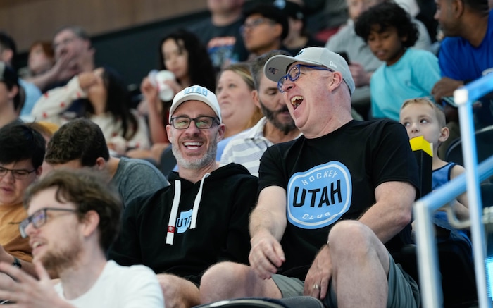 (Francisco Kjolseth  |  The Salt Lake Tribune) Brothers Dylan and Ryan Carey join the excitement as the Utah Hockey Club hosts their first NHL draft party at the Delta Center on Friday, June 28, 2024.