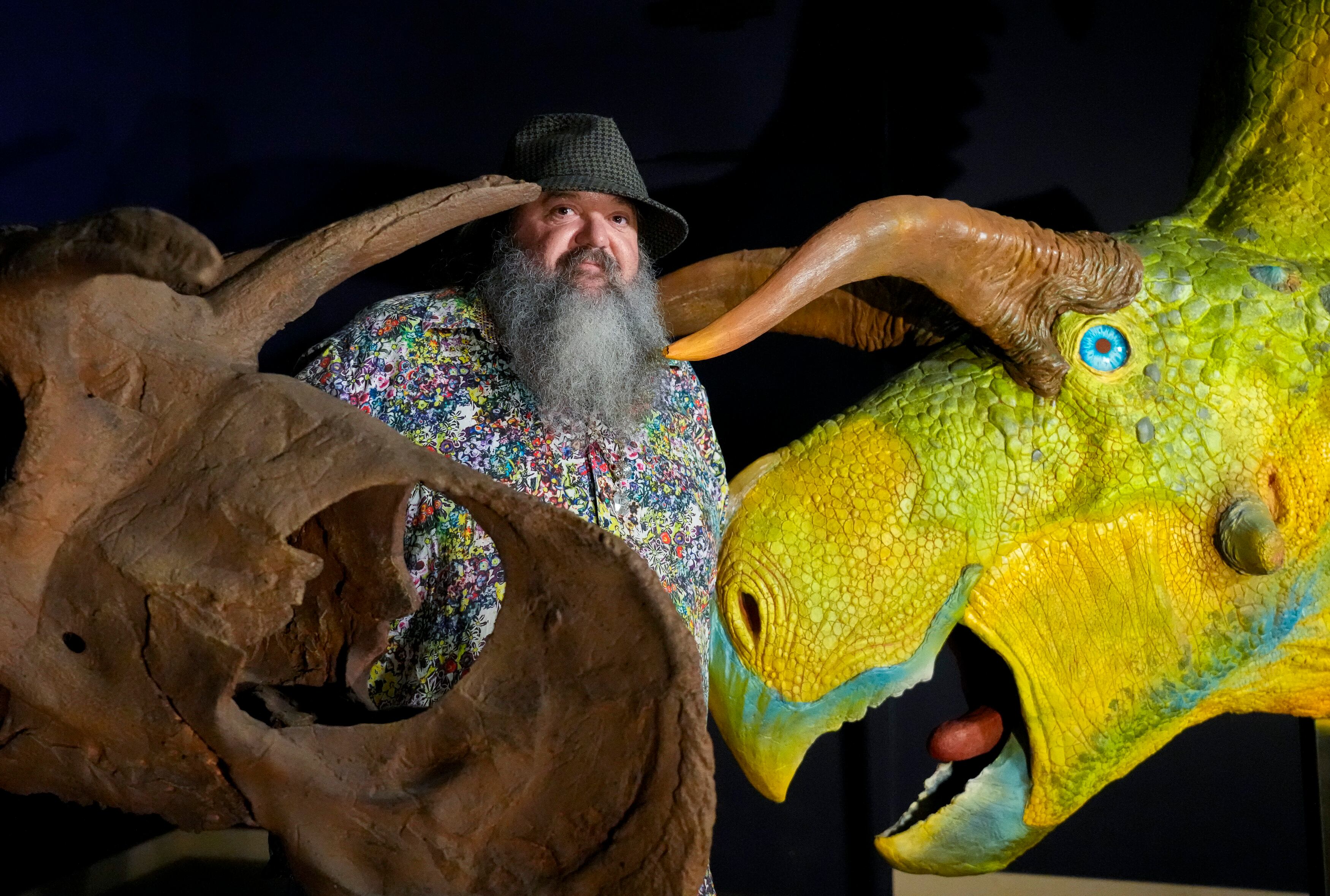 (Bethany Baker | The Salt Lake Tribune) Mark Loewen, a paleontologist at The University of Utah, stands in front of two models of the new dinosaur being unveiled at the Natural History Museum of Utah at The University of Utah in Salt Lake City on Tuesday, June 18, 2024.