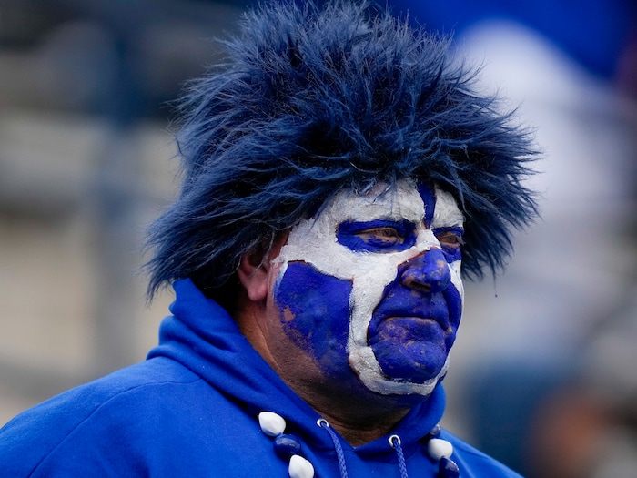 (Bethany Baker  |  The Salt Lake Tribune) A Brigham Young Cougars fan watches the game against the Oklahoma Sooners at LaVell Edwards Stadium in Provo on Saturday, Nov. 18, 2023.