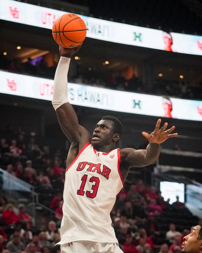 (Bethany Baker  |  The Salt Lake Tribune) Utah Utes center Keba Keita (13) goes to slam dunk the ball against the Hawaii Warriors at the Delta Center in Salt Lake City on Thursday, Nov. 30, 2023.