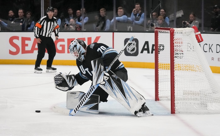 (Bethany Baker  |  The Salt Lake Tribune) Utah Hockey Club goaltender Karel Vejmelka (70) blocks a shot during the game between the Utah Hockey Club and the Colorado Avalanche at the Delta Center in Salt Lake City on Thursday, Oct. 24, 2024.