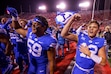 (Trent Nelson  |  The Salt Lake Tribune) Brigham Young Cougars quarterback Jake Retzlaff (12) and teammates celebrate the win as Utah hosts BYU, NCAA football in Salt Lake City on Sunday, Nov. 10, 2024. At left is Brigham Young Cougars defensive end Logan Lutui.