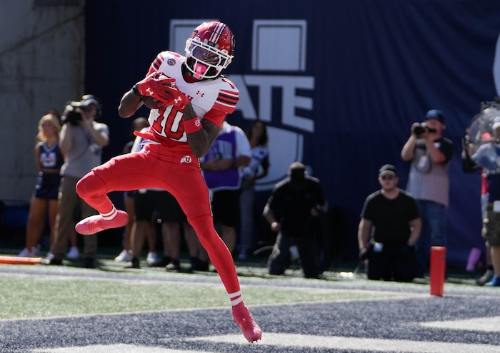 (Francisco Kjolseth  | The Salt Lake Tribune) Utah Utes wide receiver Money Parks (10) steps into the end zone for a touchdown as Utah State hosts the University of Utah during the first half of an NCAA college football game Saturday, Sept. 14, 2024, in Logan, Utah.