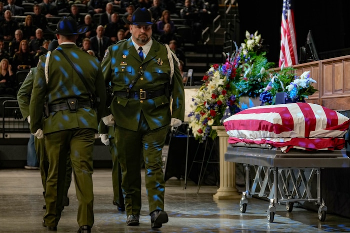 (Francisco Kjolseth  |  The Salt Lake Tribune) A changing of an honor guard during funeral services for Santaquin police Sgt. Bill Hooser at the UCCU Center at Utah Valley University on Monday, May 13, 2024.