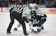 (Bethany Baker  |  The Salt Lake Tribune) Dallas Stars center Mavrik Bourque (22) and Utah Hockey Club center Alexander Kerfoot (15) vie for the puck during the second period of the NHL game at the Delta Center in Salt Lake City on Monday, Dec. 23, 2024.