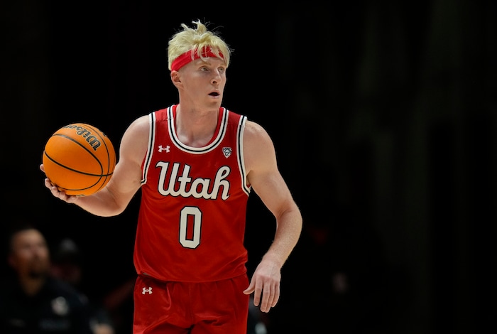 (Bethany Baker  |  The Salt Lake Tribune) Utah Utes guard Hunter Erickson (0) brings the ball down the court against the Brigham Young Cougars at the Jon M. Huntsman Center in Salt Lake City on Saturday, Dec. 9, 2023.