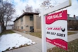 (Bethany Baker  |  The Salt Lake Tribune) A realtor sign is seen in front of a multifamily home for sale in Salt Lake City on Monday, Jan. 13, 2025.