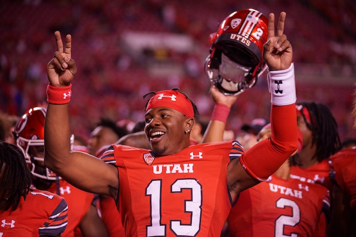 (Trent Nelson  |  The Salt Lake Tribune) Utah Utes quarterback Nate Johnson (13) celebrates the win as the Utah Utes host the Florida Gators, NCAA football in Salt Lake City on Thursday, Aug. 31, 2023.