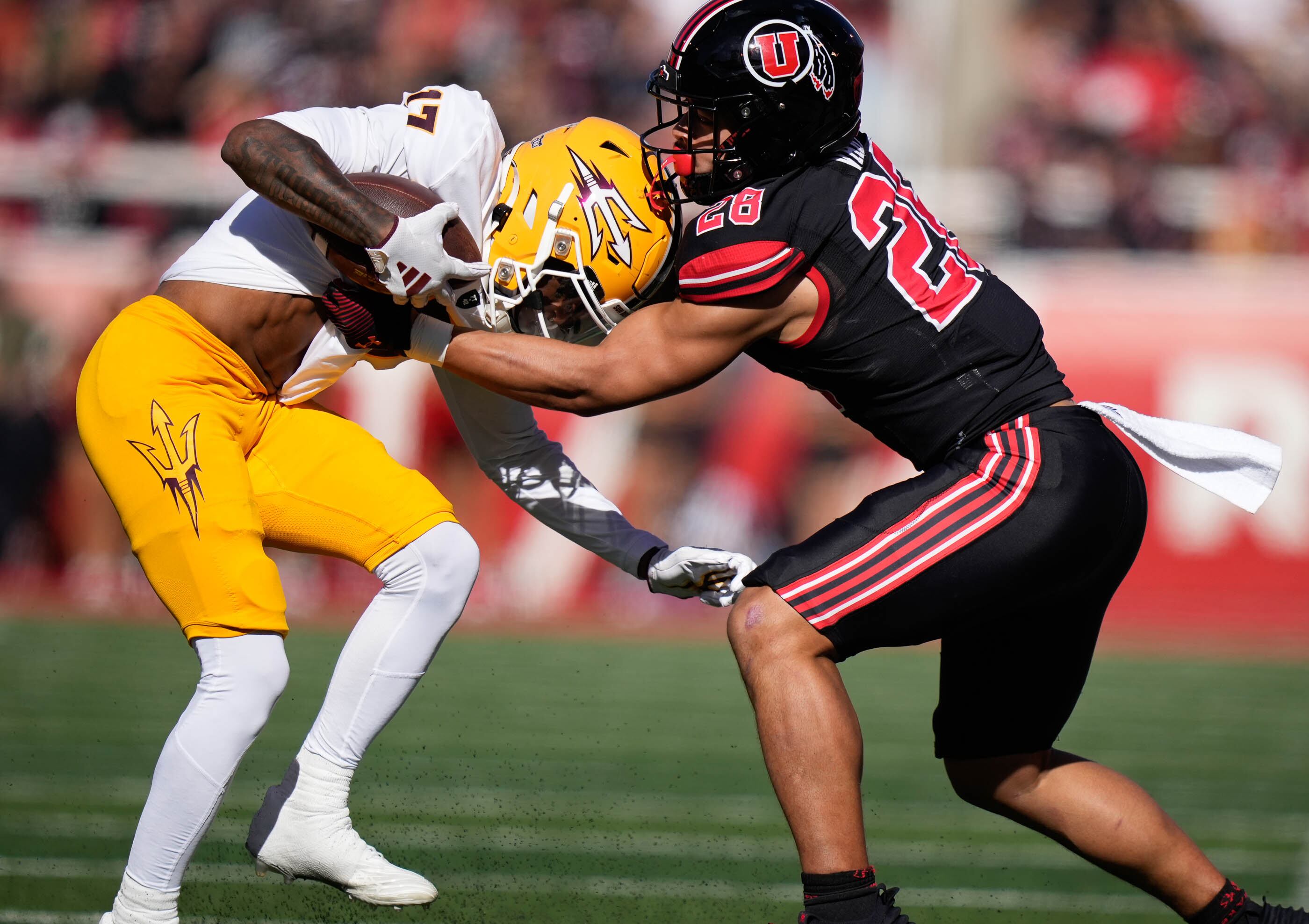 (Francisco Kjolseth | The Salt Lake Tribune) Arizona State Sun Devils wide receiver Kaleb Black (17) is taken down by Utah Utes safety Sione Vaki (28) as the Utah Utes host the Arizona State Sun Devils in NCAA football in Salt Lake City on Saturday, Nov. 4, 2023.