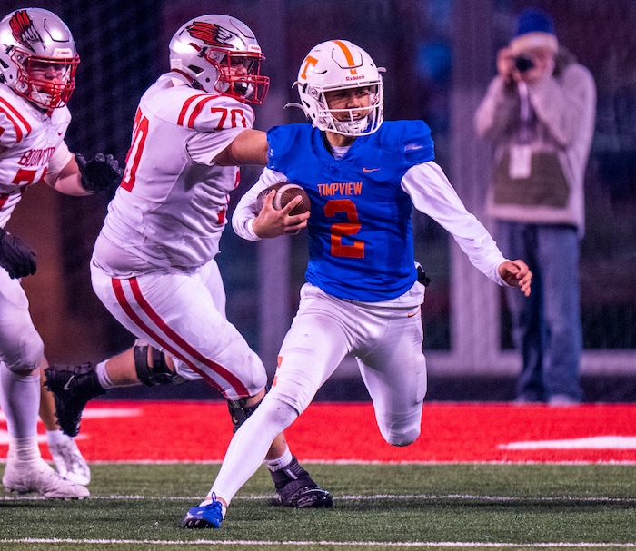 (Rick Egan | The Salt Lake Tribune)   Quarterback Helaman Casuga runs for Timpview, in 5A State playoff action between the Timpview Thunderbirds and the Bountiful Redhawks, at Rice-Eccles Stadium, on Friday, Nov. 17, 2023.
