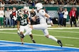 Penn State quarterback Beau Pribula, defended by Michigan State defensive back Khalil Majeed (34), runs for a 2-yard touchdown during the second half of an NCAA college football game, Friday, Nov. 24, 2023, in Detroit. (AP Photo/Carlos Osorio)