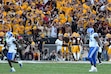 BYU players walk off the field as Arizona State fans and players celebrate an interception during the second half of an NCAA college football game Saturday, Nov. 23, 2024, in Tempe, Ariz. Arizona State won 28-23. (AP Photo/Ross D. Franklin)