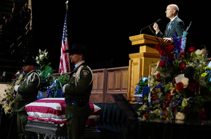 (Francisco Kjolseth  |  The Salt Lake Tribune) Utah Gov. Spencer Cox speaks during funeral services for Santaquin police Sgt. Bill Hooser at the UCCU Center at Utah Valley University on Monday, May 13, 2024.