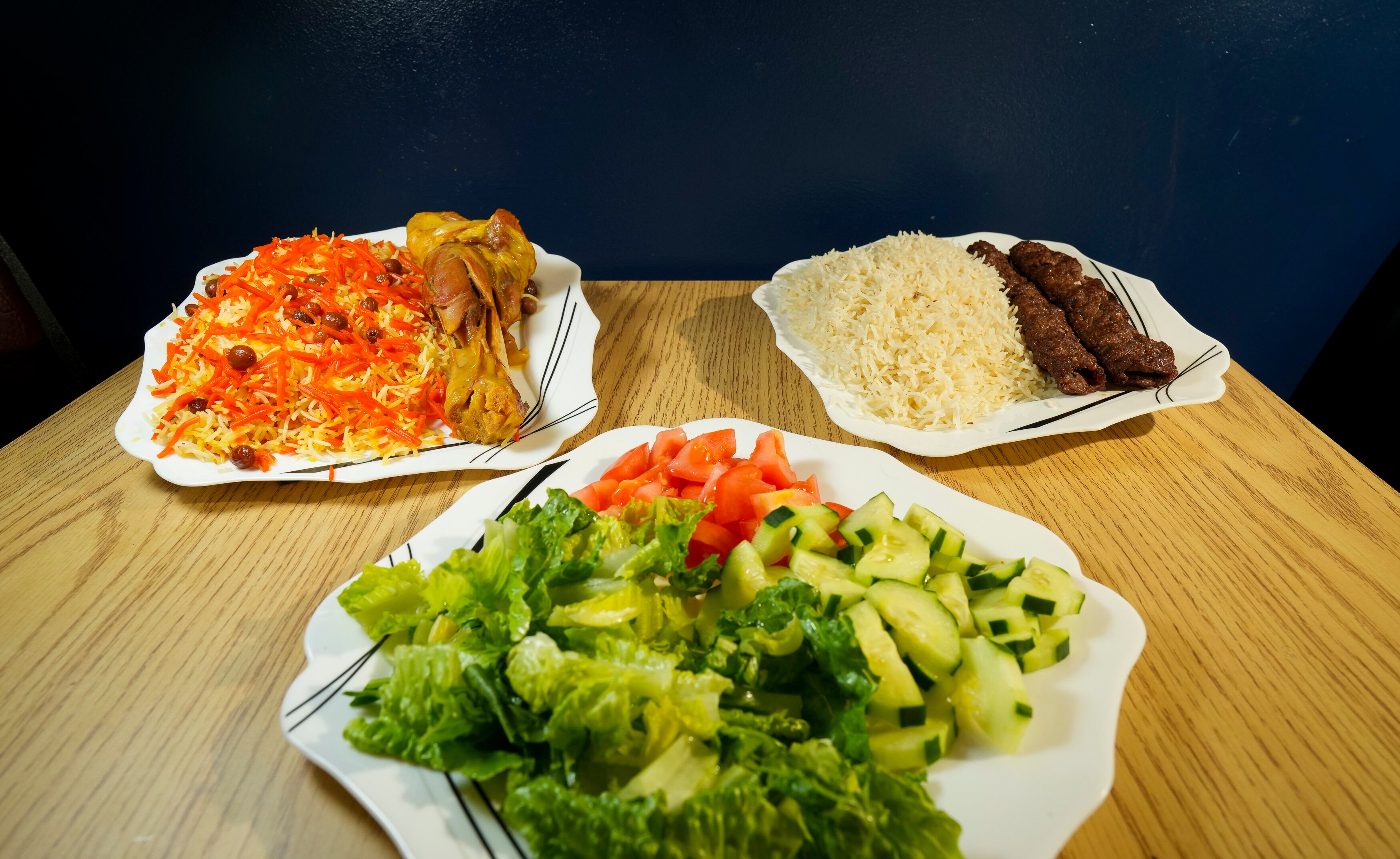 (Bethany Baker | The Salt Lake Tribune) The shank kabuli and the shami kabob sit beside a salad plate at Kabul Kitchen in West Valley City on Aug. 1, 2024.