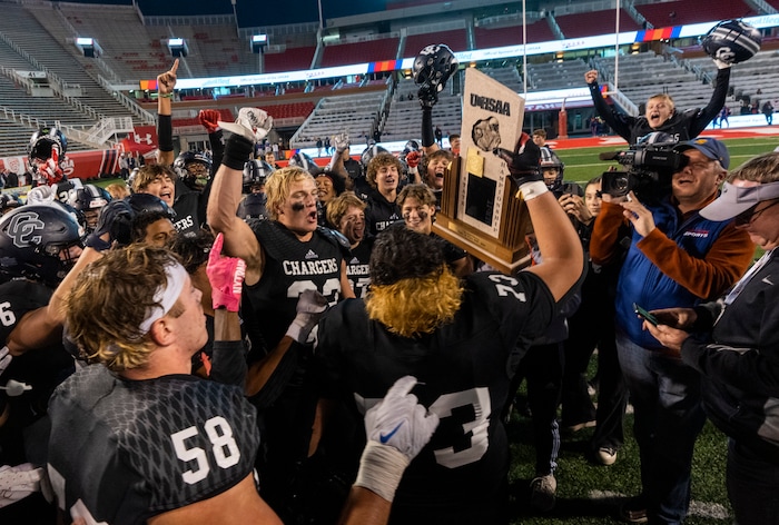 (Rick Egan | The Salt Lake Tribune) The Corner Canyon Chargers celebrate their win over the Skyridge Falcons, for the 6A State championship at Rice-Eccles Stadium, on Friday, Nov. 17, 2023.