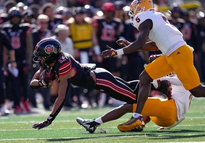 (Francisco Kjolseth  |  The Salt Lake Tribune) Utah Utes wide receiver Devaughn Vele (17) gets a first down as the Utah Utes host the Arizona State Sun Devils in NCAA football in Salt Lake City on Saturday, Nov. 4, 2023.