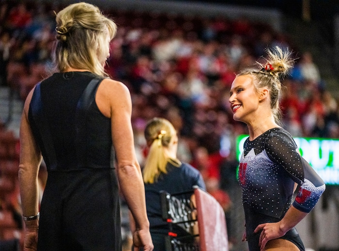 (Rick Egan | The Salt Lake Tribune)  Utah coach Carly Dockendorf talks to Abby Paulson after her performace on the the beam, for Utah, during a meet between Utah, LSU, Oklahoma and UCLA at the Maverik Center, on Saturday, Jan. 13, 2024.