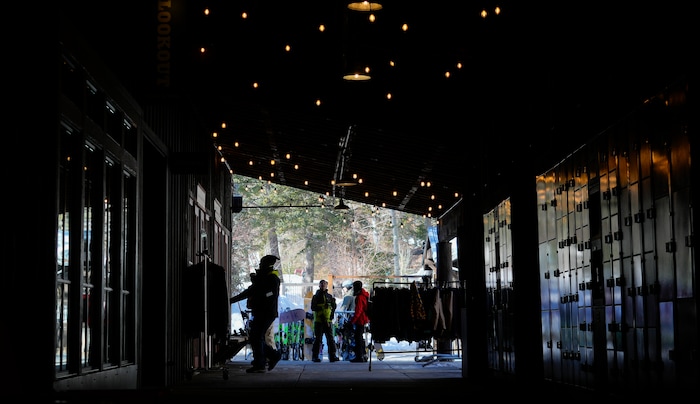 (Bethany Baker  |  The Salt Lake Tribune) People gather outside one of the shops at Sundance Resort near Provo on Thursday, Dec. 14, 2023.