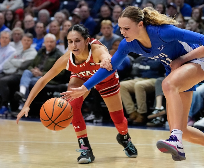 (Francisco Kjolseth  | The Salt Lake Tribune) Utah Utes guard Ines Vieira (2) scrambles for a loose ball with BYU Cougars guard Delaney Gibb (11) as BYU hosts Utah, NCAA basketball in Provo on Saturday, Jan. 25, 2025.