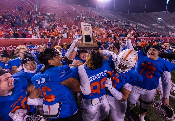 (Rick Egan | The Salt Lake Tribune)   The Timpview Thunderbirds celebrate their 5A State Championship over the Bountiful Redhawks, at Rice-Eccles Stadium, on Friday, Nov. 17, 2023.
