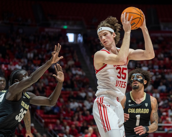 (Rick Egan | The Salt Lake Tribune) Utah Utes center Branden Carlson (35) is guarded by Colorado Buffaloes forward Assane Diop (35) and Colorado Buffaloes guard J'Vonne Hadley (1), in PAC-12 basketball action between the Utah Utes and the Colorado Buffaloes a the Jon M. Huntsman Center, on Saturday, Feb. 3, 2024.
