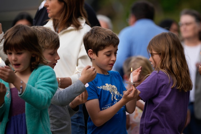 (Francisco Kjolseth  |  The Salt Lake Tribune) Uintah Elementary schoolmates gather for a candlelight memorial at Laird Park in Salt Lake City on Wednesday, May 22, 2024, to honor Adlai Owen. Police say Adlai’s father, Sam Owen, fatally shot Adlai before killing himself in an apparent murder-suicide on Saturday, May 18, 2024.