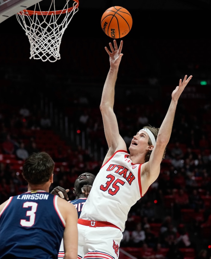 (Francisco Kjolseth  |  The Salt Lake Tribune)Utah Utes center Branden Carlson (35) makes a shot over Arizona Wildcats guard Pelle Larsson (3) in PAC-12 basketball action between the Utah Utes and the Arizona Wildcats at the Jon M. Huntsman Center, on Thursday, Feb. 8, 2024.