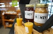 (Bethany Baker  |  The Salt Lake Tribune) Local honey from Keeper of the B sits on display at the Utah's Own Holiday Shoppes at Millcreek Common in Millcreek on Thursday, Dec. 5, 2024.