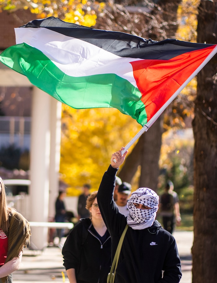 (Rick Egan | The Salt Lake Tribune)  Supporters of Mecha cheer along with the speakers, during a protest on the University of Utah Campus, on Wednesday, Nov. 15, 2023.
