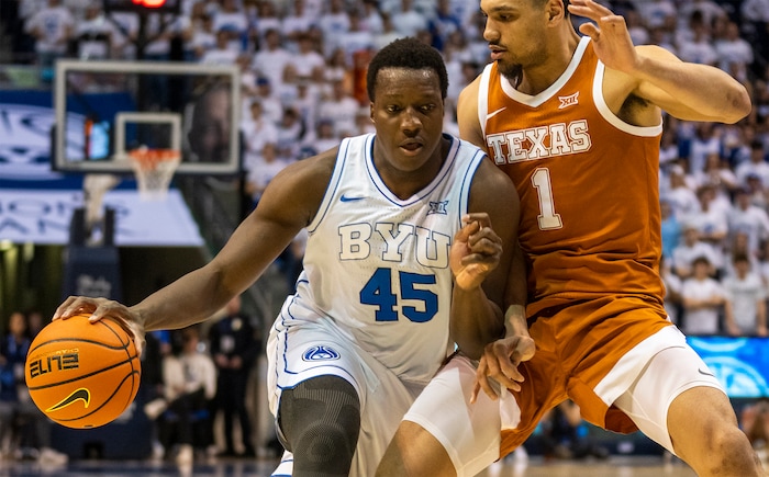 (Rick Egan | The Salt Lake Tribune) Brigham Young Cougars forward Fousseyni Traore (45) takes the ball inside, as Texas Longhorns forward Dylan Disu (1) defends, in basketball action between the Brigham Young Cougars and the Texas Longhorns, at the Marriott Center, on Saturday, Jan. 27, 2024.
