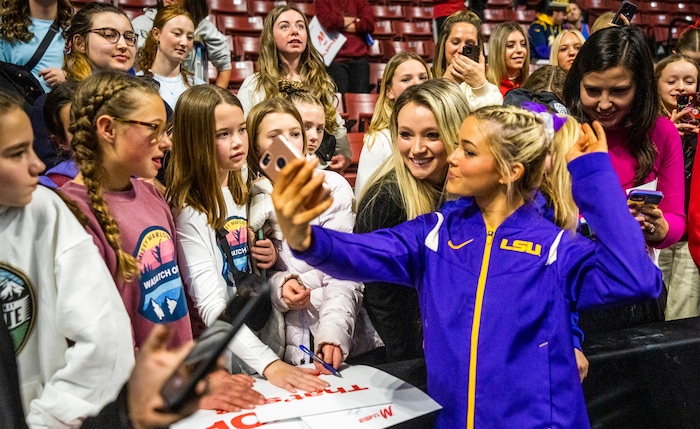 (Rick Egan | The Salt Lake Tribune)  LSU gymnast Livvy Dunne takes a selfie with fans after a gymnastics meet between Utah, LSU, Oklahoma and UCLA at the Maverik Center, on Saturday, Jan. 13, 2024.
