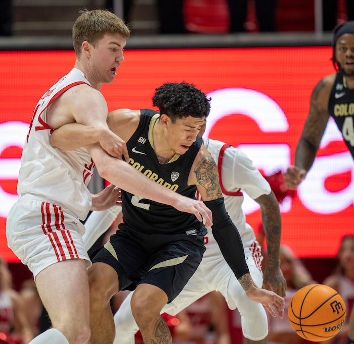 (Rick Egan | The Salt Lake Tribune) Utah Utes center Lawson Lovering (34) gets tangled up with Colorado Buffaloes guard KJ Simpson (2), in PAC-12 basketball action between the Utah Utes and the Colorado Buffaloes a the Jon M. Huntsman Center, on Saturday, Feb. 3, 2024.
