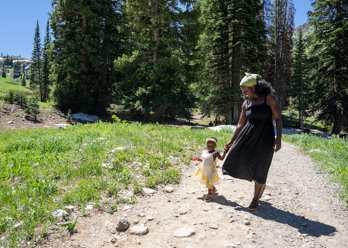 (Rick Egan | The Salt Lake Tribune)  Naomi and Cheryl Neufville look for wildflowers on the trail to Cecret Lake, in Little Cottonwood Canyon, on Wednesday, July 12, 2023.
