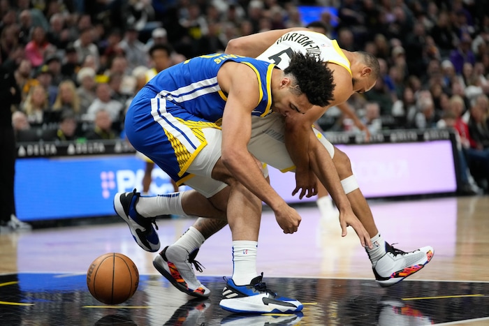 (Francisco Kjolseth  |  The Salt Lake Tribune) Golden State Warriors forward Trayce Jackson-Davis (32) and Utah Jazz guard Talen Horton-Tucker (5) battle for possession during an NBA basketball game Thursday, Feb. 15, 2024, in Salt Lake City.