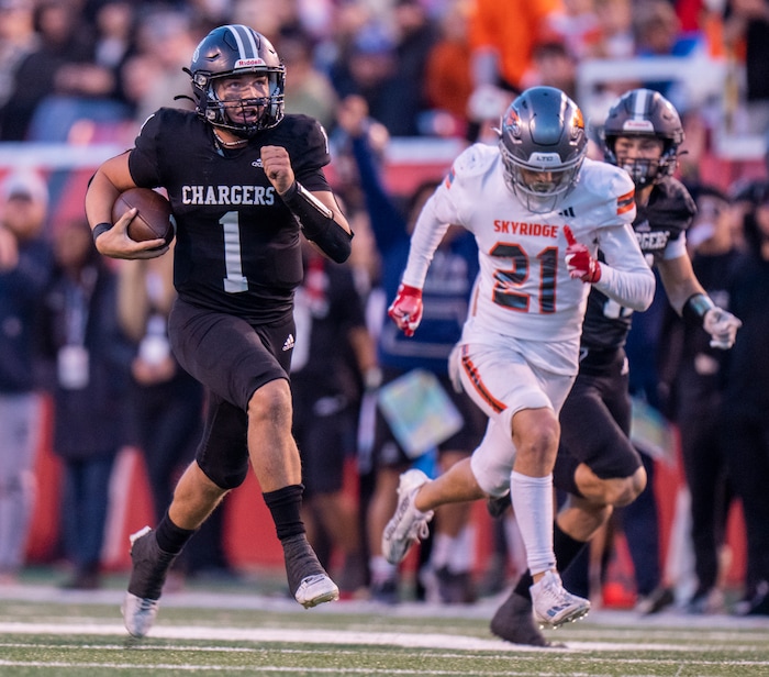 (Rick Egan | The Salt Lake Tribune) Corner Canyon QB Isaac Wilson (1), runs for a touchdown, in the Chargers 6A State championship win over the Skyridge Falcons, at Rice-Eccles Stadium, on Friday, Nov. 17, 2023.