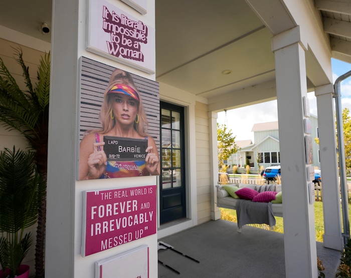 (Bethany Baker  |  The Salt Lake Tribune) A home is decorated in the “Real World Barbie” theme from the movie “Barbie” in a section of Daybreak that has collectively created a Barbieland-themed community for Halloween on Wednesday, Oct. 11, 2023.