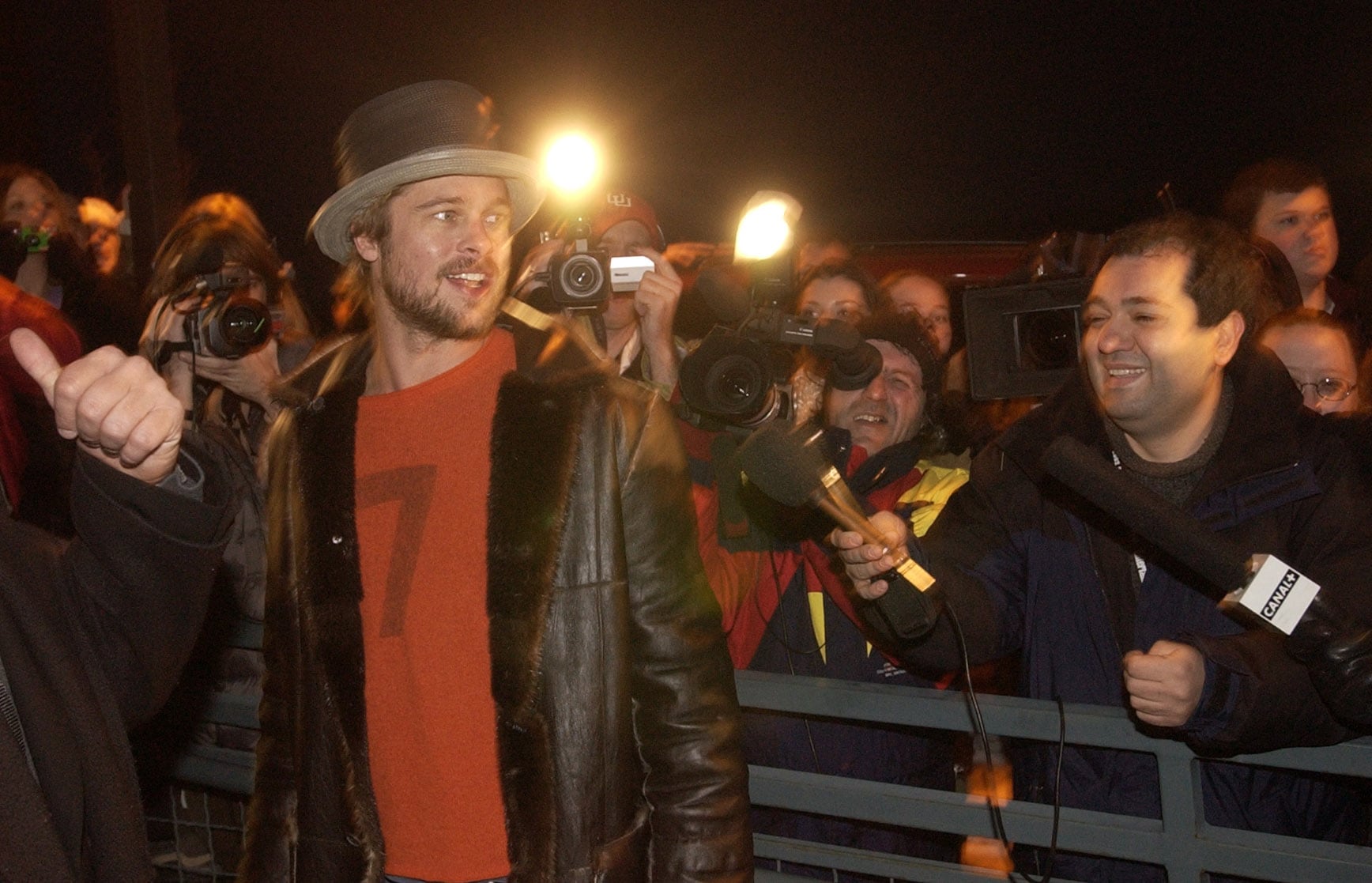 (Rick Egan | The Salt Lake Tribune) Actor Brad Pitt makes his way past hundreds of photographers and fans to a Sundance premiere in Park City, Saturday, Jan. 12, 2002.