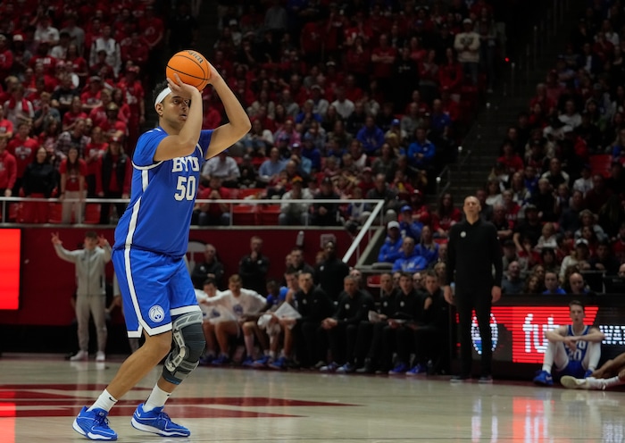 (Bethany Baker  |  The Salt Lake Tribune) Brigham Young Cougars center Aly Khalifa (50) shoots a three point basket against the Utah Utes at the Jon M. Huntsman Center in Salt Lake City on Saturday, Dec. 9, 2023.