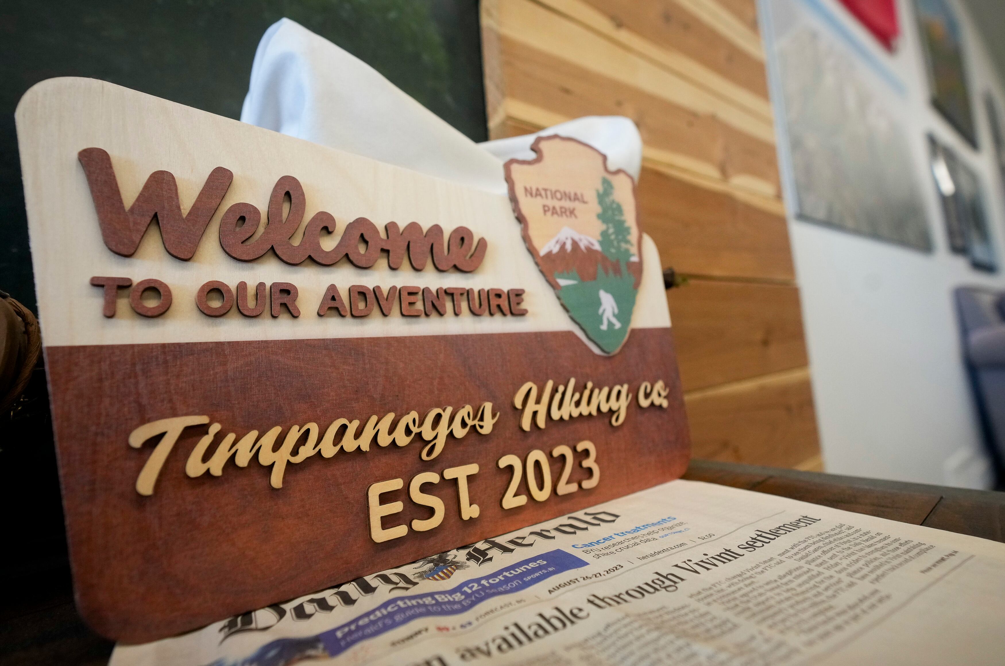 (Bethany Baker | The Salt Lake Tribune) A sign leans up against a wall at Timpanogos Hiking Co. in Provo on Wednesday, May 8, 2024.