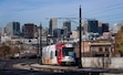 (Francisco Kjolseth | The Salt Lake Tribune) The Salt Lake City skyline and a TRAX light rail car are pictured on Monday, Nov. 25, 2024.