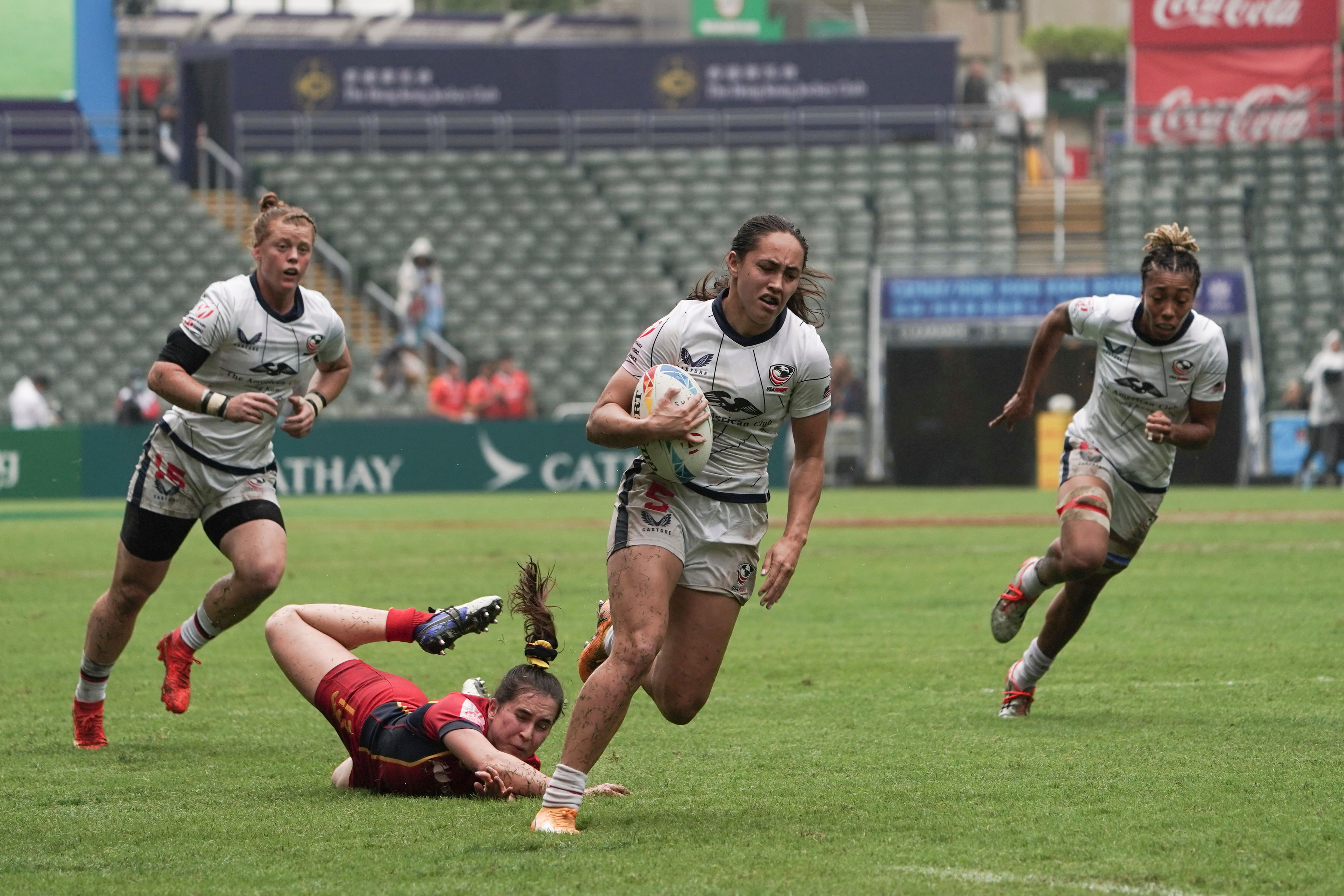 (Anthony Kwan | AP) USA's Alex Sedrick scores a try as she breaks away from Spain's Bruna Elias's tackle during the first day of the Hong Kong Sevens rugby tournament in Hong Kong, Friday, March 31, 2023.