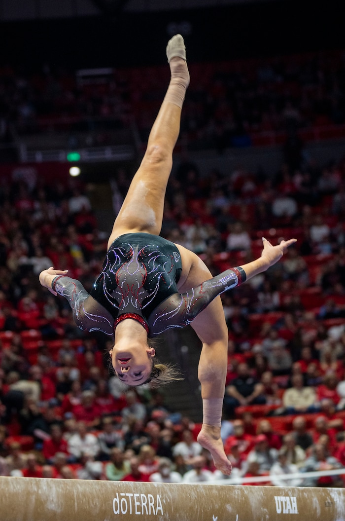 (Rick Egan | The Salt Lake Tribune)  Makenna Smith performs on the beam, in gymnastics action between Utah Red Rocks and Oregon State, at the Jon M. Huntsman Center, on Friday, Feb. 2, 2024.
