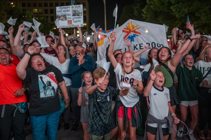 (Rick Egan | The Salt Lake Tribune) Crowds cheer as Salt Lake City is announced as hosts for the 2034 Winter Olympics at Salt Lake City Hall, Wednesday, July 24, 2024.