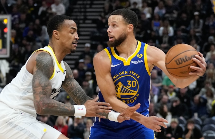 (Francisco Kjolseth  |  The Salt Lake Tribune) Utah Jazz forward John Collins (20) collins defends against Golden State Warriors guard Stephen Curry (30) during an NBA basketball game Thursday, Feb. 15, 2024, in Salt Lake City.