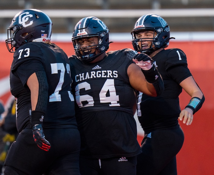 (Rick Egan | The Salt Lake Tribune) Corner Canyon celebrates after QB Isaac Wilson (1), ran for a touchdown, in the Chargers 6A State championship win over the Skyridge Falcons, at Rice-Eccles Stadium, on Friday, Nov. 17, 2023.