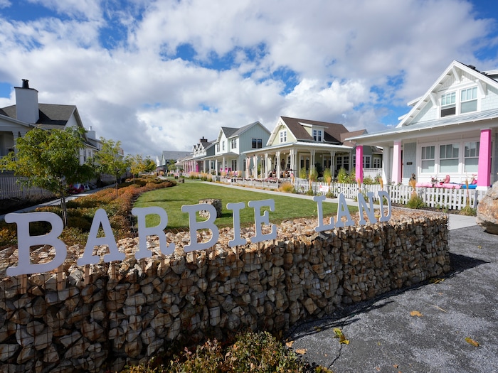 (Bethany Baker  |  The Salt Lake Tribune) A Barbieland sign stands at the end of a path in a section of Daybreak that has collectively created a Barbieland-themed community from the movie “Barbie” for Halloween on Wednesday, Oct. 11, 2023.